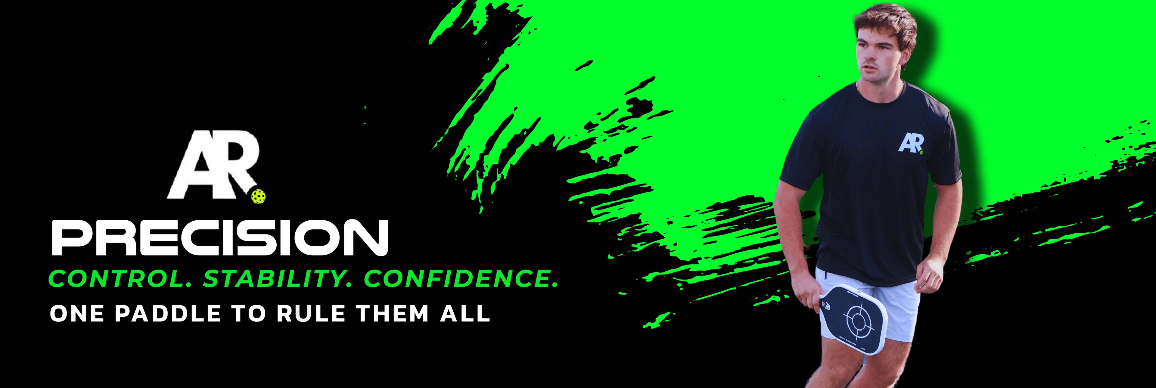 Person holding a paddle with 'AR Precision' branding against a green and black background